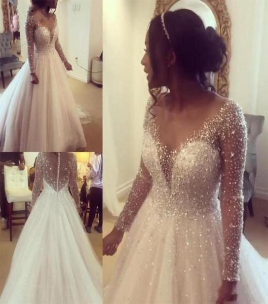 Bling Bling Illusion maniche lunghe abito da sposa principessa 2020 scollo trasparente gioiello perline di cristallo Aline vita impero africano Weddi8991877