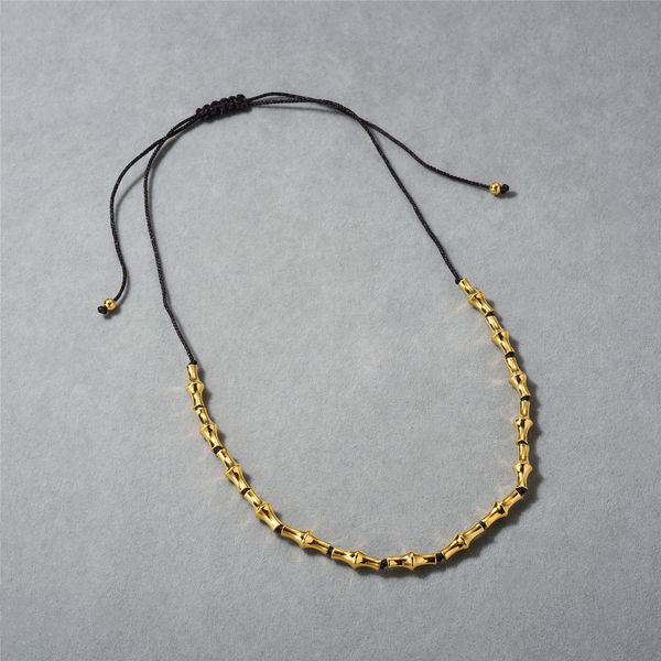 Novo colar pull-up de corda tecida com osso de bambu retrô europeu e americano, um item obrigatório para o deslocamento diário da moda feminina, corrente de clavícula simples e elegante