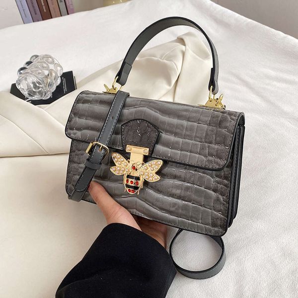 Loja atacado designer bolsa de ombro bolsa feminina 2024 novo ombro único crossbody saco portátil padrão de pele de cobra textura de alta qualidade pequeno quadrado