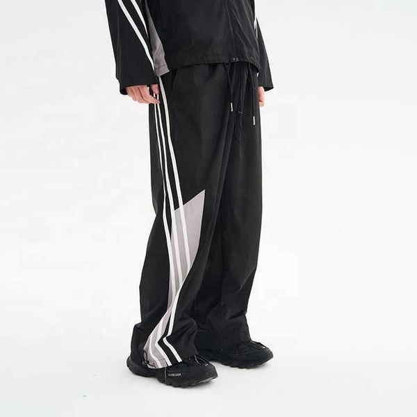Calças de streetwear personalizadas Calças de poliéster de nylon com costura solta Calças de moletom Calças masculinas