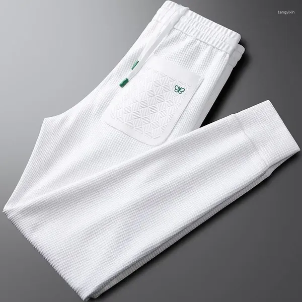 Calças masculinas high end seda gelo respirável modal casual com logotipo borboleta verde moda cintura elástica esportes de verão