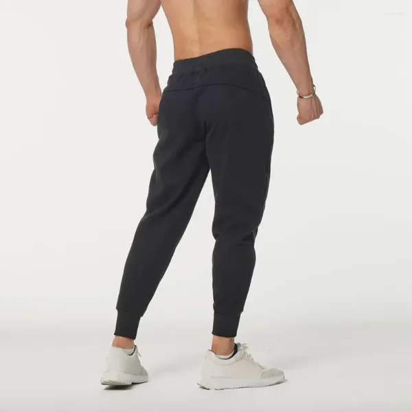 Pantaloni da uomo da uomo che corrono vestibilità ampia sportiva con tasche laterali alla caviglia con coulisse in vita elastica per allenamento in palestra, jogging