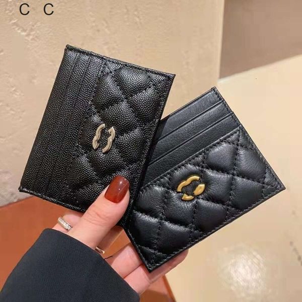 Bolsa feminina promoção de fábrica frete grátis camada de cabeça bolsa de caminhão de couro para mulheres pequena grade xiangling ultrafina e requintada porta-cartões caviar anti-roubo