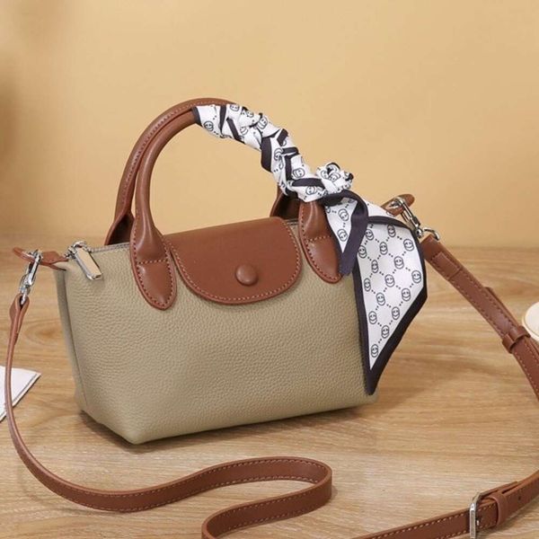 Shop Crossbody Bag billige Exporte einzigartige Textur 2024 Neues echtes Leder Damen Vielseitiger Mini -Schulter -Handtasche Knödelbrötchen
