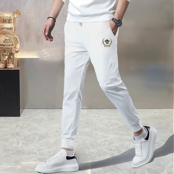 Pantaloni sportivi casual autunnali e invernali di fascia alta, tendenza della moda maschile, colori contrastanti, cinghie intrecciate, pantaloni sanitari a gamba dritta, vestibilità slim