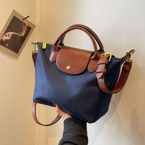 Shoppen Sie Umhängetasche Günstige Export 2024 Neue Oxford-Stoff Damen Textur Mode Splicing Dumpling Bun Einfache Handtasche