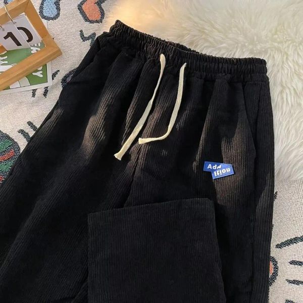 Calças masculinas homens coreano moda fivela casual bloomers calças corredores hip hop cordão sweatpants homem solto sólido