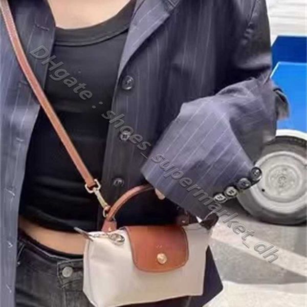 Bolsa Clearance Varejo Atacado 95% Off Luxurys Bolsas Ombro Cruz Versão Única Mudança Portátil Mini Carry Dumpling Moda Couro Mulheres