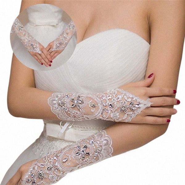 1 Paar weiße Elfenbein-Frauen-Fingerl-Brauthandschuhe Eleganter kurzer Absatz Rhineste weiße Spitze-Handschuh-Hochzeit Accories N2Ud #