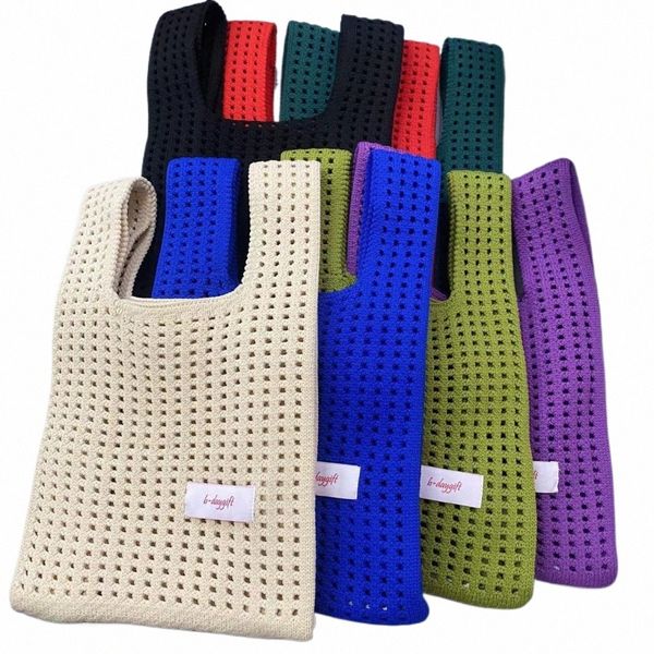 Minimalistische gestrickte Handtasche Damen Handtasche Sommer aushöhlen häkeln einfarbig handgemachte Strickknoten Handgelenktasche Shop Tote V6Fy #