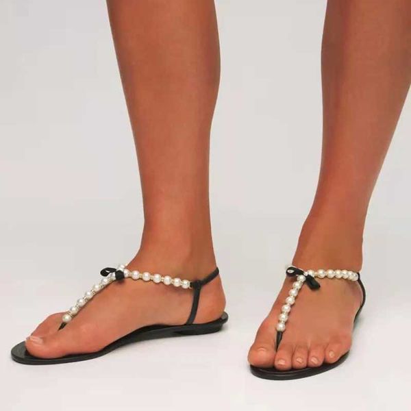 Sandálias de verão das mulheres 2023 nova moda ao ar livre plana praia sexy pérola arco-nó sapatos feminino clip toe flip flops slides h240328t1rz