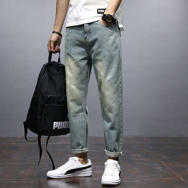 Calça jeans masculina outono e inverno com perna reta e solta, marca moderna com furos, versão coreana calça rabanete masculina moderna e versátil
