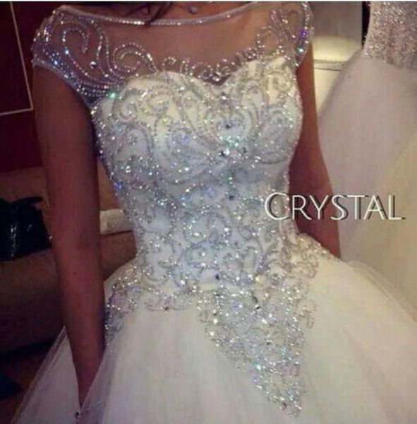 Luxuoso strass cristais princesa vestidos de casamento 2019 vendendo nova imagem real manga boné vestido de baile tule sheer nupcial go8934733