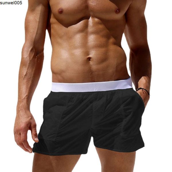 Shorts de grife estão vendendo bem.Calça de praia masculina sem forro transparente sexy shorts moda casual