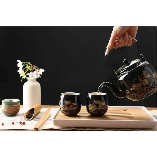 Tee -Sets Japanisch schöne asiatische Porzellantee -Set schwarz mit 1 Teekanne 6 Teebassen 1 Tee Tablett 1 Edelstahl -Infuser für Erwachsene