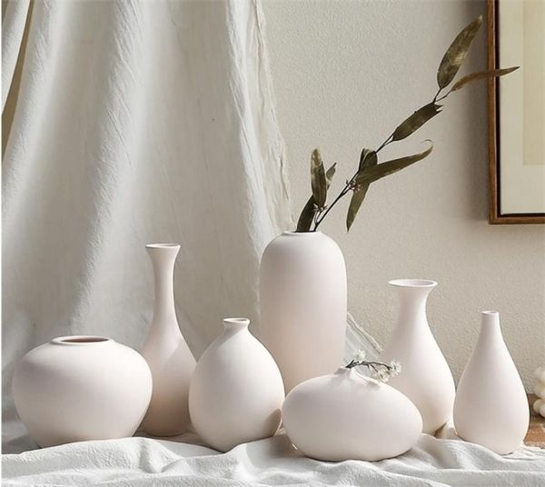 Vasos brancos Decoração da sala de estar decoração Decoração da sala de decoração de cerâmica e vasos de porcelana para flores artificiais Figuras decorativas 22991827