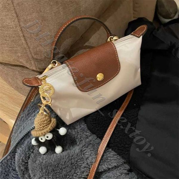 Varejo por atacado Mini genuíno bolsa de luxo designers de bolsa crossbody fontes de frete de couro femme saco de bolsa de bolas de bolas de bolas de bolas de bolas de bolas