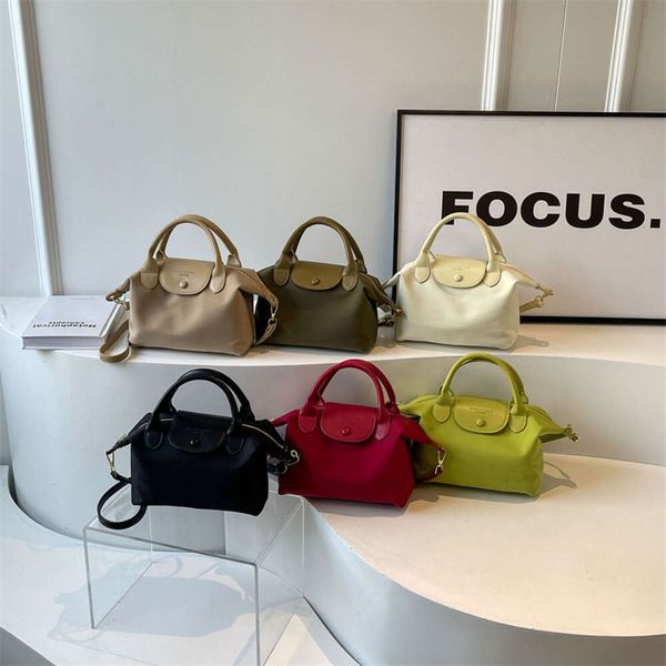 Luxury Bolda Designer Bolsa de Marca Feminina No início da primavera New Crossbody Bag Bag do telefone feminino Nylon Nylon Leve e versátil Handheldgtor