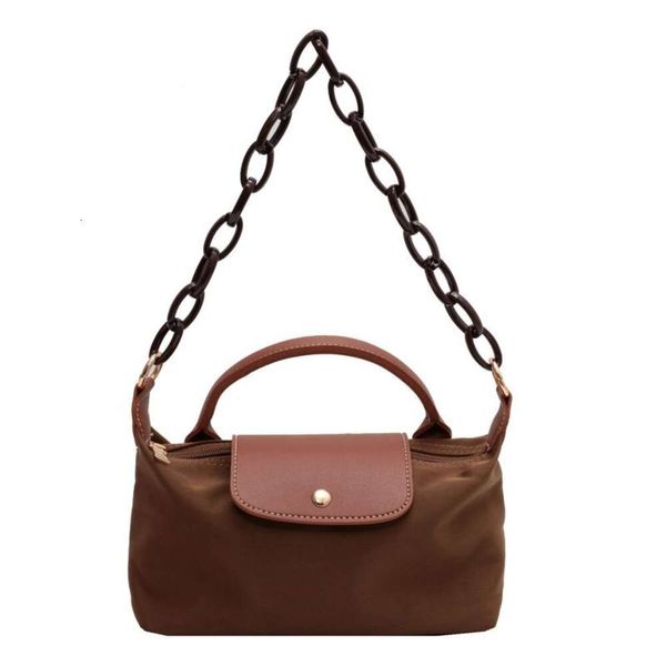 Shop meistverkaufte Umhängetasche Neu 85% Fabrik Direktverkauf Dumpling Bun Mini Crossbody kleine und beliebte Tasche Damenfarben Farbige vielseitige klassische Ausgangsbeutel