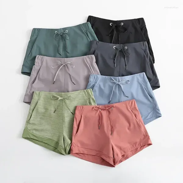 Shorts Shorts Lemon Tummy Control Yoga Capris per donne con tasche per telefoni allenamento con cucitura in rete a 4 vie