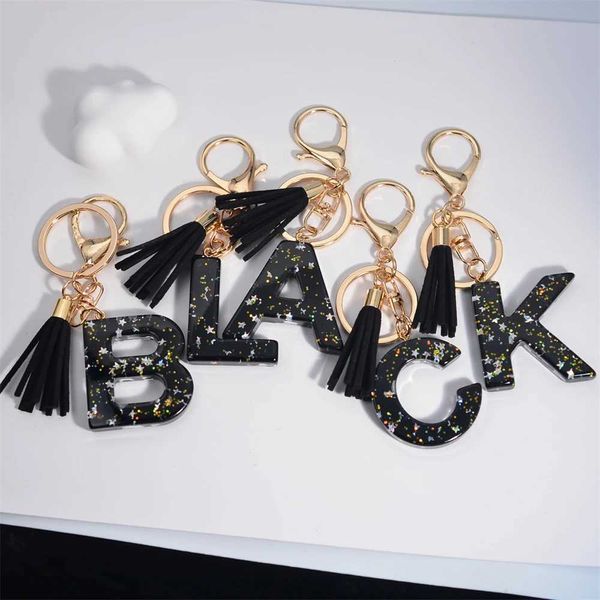 Tornari per latte Black Letter Calketchain con nappe lunghe Resina glitter A-Z Iniziali alfabeti a ciondolo a sospensione Donne per la borsa regali decorativi del telefono J240509