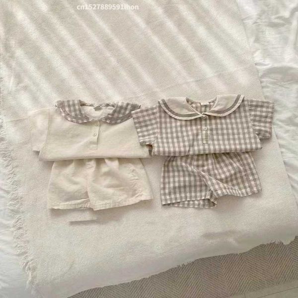 Conjuntos de roupas 2024 Summer New Baby Navy Collar Claid Rousel Conjunto Ldren Tops de manga curta + shorts 2pcs Terno para meninos meninas roupas infantis H240508
