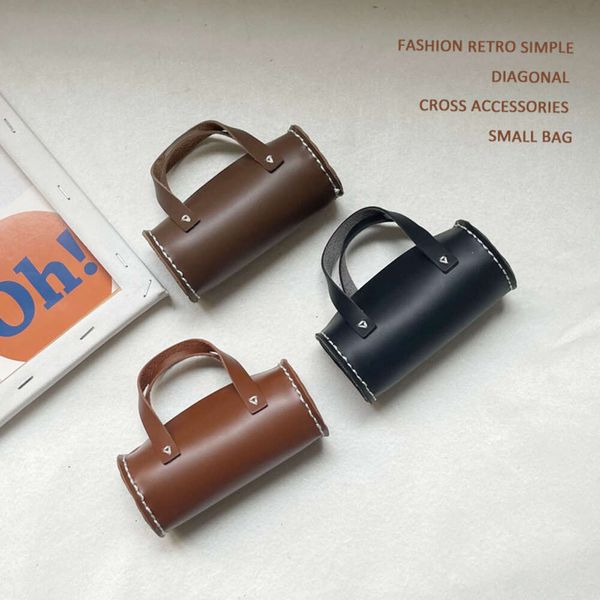 Instagram südkoreanische Kinder modische Jungen und Mädchen Mini -Handle Konkave -Accessoires Cross Lod Bag 80% Fabrik Großhandel