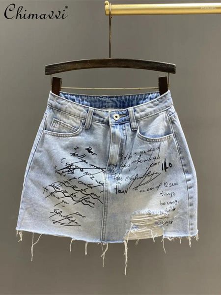 Röcke Modelöcher gedruckter Brief hoher Taille Jeans Rock Frauen Sommer Schlanker vielseitiger Anti-Exposition A-Line Mini Girl