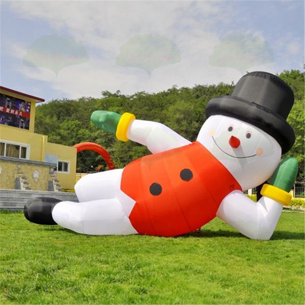 Jogos de 10m de comprimento (33 pés) personalizados boneco de neve personalizado, boneco de neve inflável deitada em pé de decoração de balão ar caráter de inverno deitado com chapéu vermelho