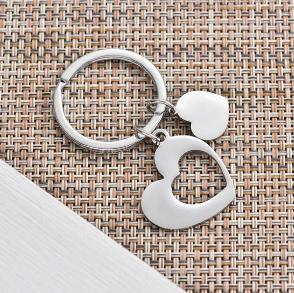 Charms -chave no atacado Chave de aço inoxidável correspondente do coração do coração para mulheres homens