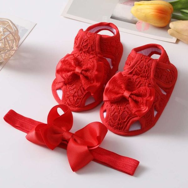 Sommer Baby Girl Bowknot Hollow Prinzessin flache Anti-Rutsch-Baumwoll-Sohle Kleinkind Krippe Schuhe Neugeborene Mädchen Sandalen L2405