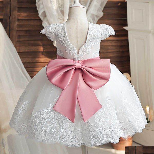 Платья для девочек Белое платье для крещения для маленьких девочек на первый день рождения с розовым бантом Платье-пачка с цветком для свадебной церемонии Летняя вечеринка Cos Dh5Um