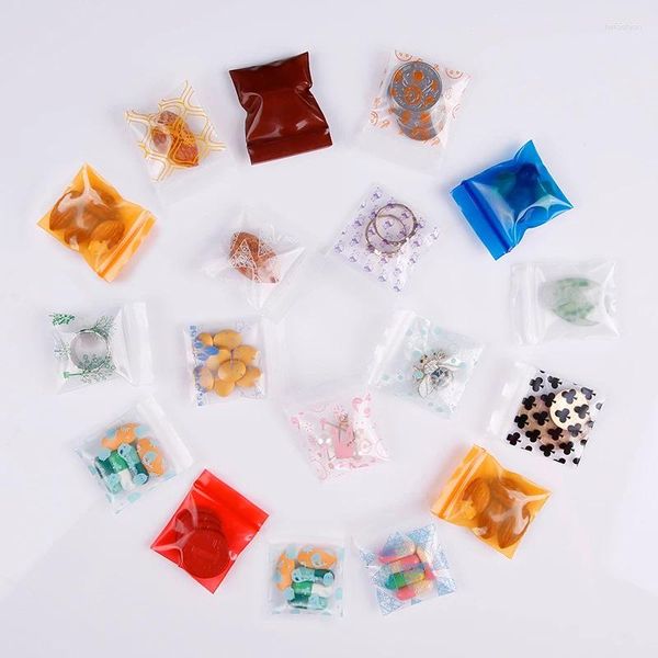 Aufbewahrungstaschen 100pcs/Los transparentes Plastik -Cartoon für Lebensmittel Schmuck Verpackung Beutel süße Mini -Geschenke