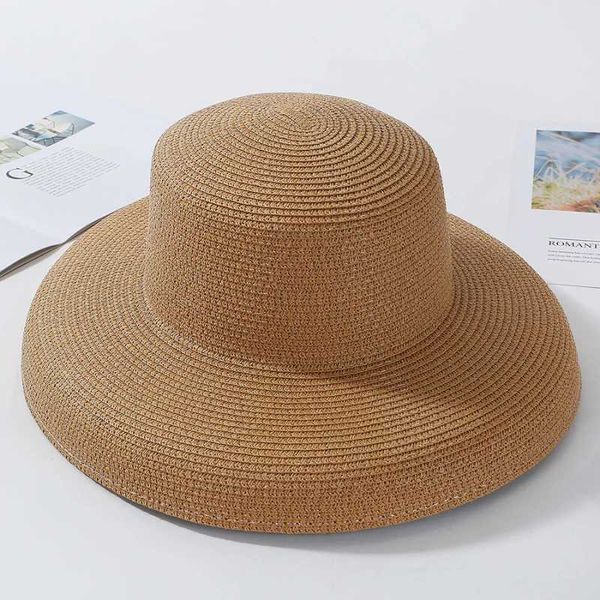 Cappelli a bordo larghi cappelli a secchio 2023 Nuovi cappelli da sole estivi Ladies Solido semplice cappello a bordo largo femmina top rotonda top panama floppy paglia da spiaggia per cappelli da spiaggia 240407