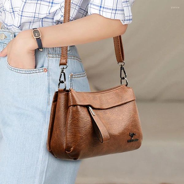 Bolsas de ombro bolsa feminina de moda bolsa feminina simples para design da moda Decoração de bolsa portátil Acessórios de couro Crossbody