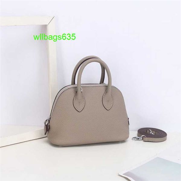 Bolide Leder Handtasche vertrauenswürdige Luxus Frauenbeutel 2024 Neues 18cm -Schalen -Wickel -Kopf -Schicht Cowhide Litchi Muster Mini Bowling Ball Handheld Genui Have Logo Hb7g7c