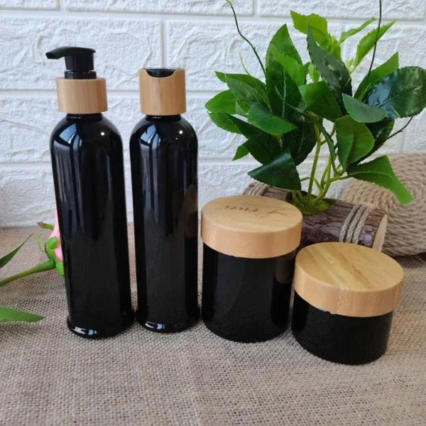 Bottiglie di stoccaggio all'ingrosso ambra/nero glassata/bianca/trasparente in plastica e crema barattoli di bamboo bottiglia di cosmetico contenitori vaso in massa.