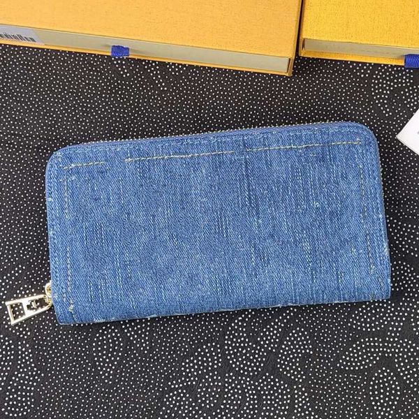 Cowboy m82958 azul jeans de titular de carteira de carteira de zíper azul designers de carteira de crédito homens e mulheres passaportes de passaporte comercial bolso de moeda