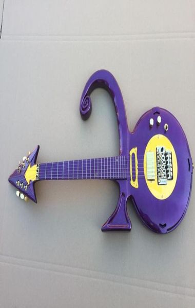 Unique Gitarre Rare Form geformte Gitarre Metallic Purple Prince Symbol Elektrische Gitarre Floyd Rose Tremolo Bridge Gold Hardware Top Selling6273571