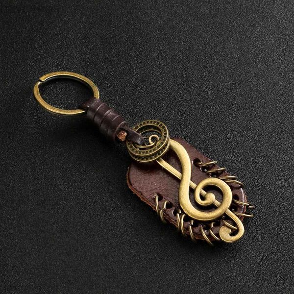 Keychains Lanyards 2024 Fashion Vintage Brown echtes Lederflügel Kompass Musiksymbol Schlüsselbund Charme Handarbeit Legierung Accessoires Männer Schlüsselkette D240417