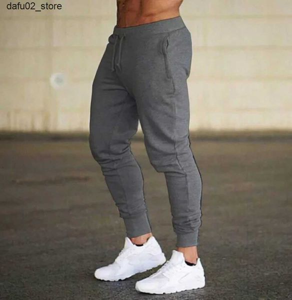Мужские брюки 2024 Модные мужские спортзал с твердыми цветами брюки беггера фитнес -брюки Мужские спортивные брюки.