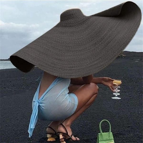 Cappello di paglia da spiaggia di grandi dimensioni per donne alla moda grandi cappelli da visiera larghi arrotolati fatti a mano Floppy Sun Summer Cap 240415