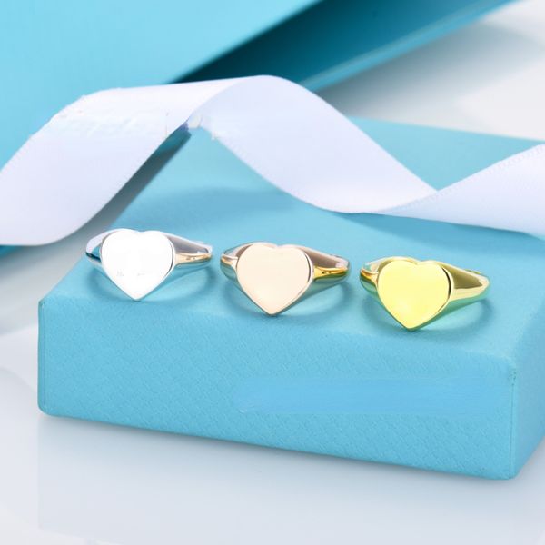 Designer Rings Rings Couples New Glaze em forma de coração Anel em forma de coração Branco de cobre 18k Cartas de aço CNC reais de ouro