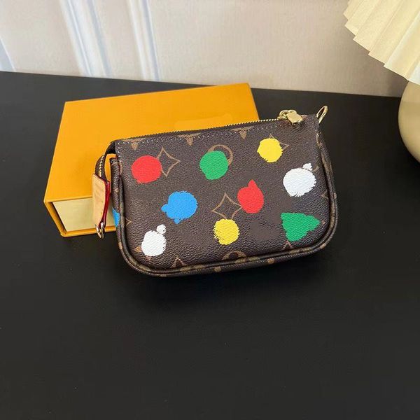 24SS Women Luxurys Designers Titulares de cartões Bolsas de carteiras de onda Ponto colorido Bolsa de couro genuíno Carteiras de viagem Moedas de moeda com presente ARVV