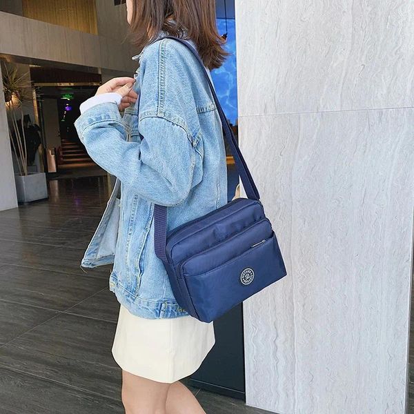 Borse da sera 2024 Casual Solid Color Women Designer Luxury Spall Bagna Nylon Cloth Lady Messenger Mobile Telefono all'ingrosso