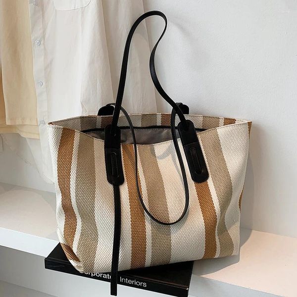 Omuz çantaları lüks şerit tasarımcısı Kadınlar için yüksek kapasiteli çanta 2024 moda marka alışveriş tuval tote çanta