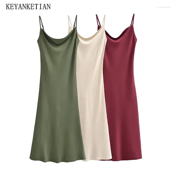 Повседневные платья Keyanketian 2024 запустить женское внутреннее стиль атласное платье просто сексуальное тонкое без спины спагетти лодыжки Midi