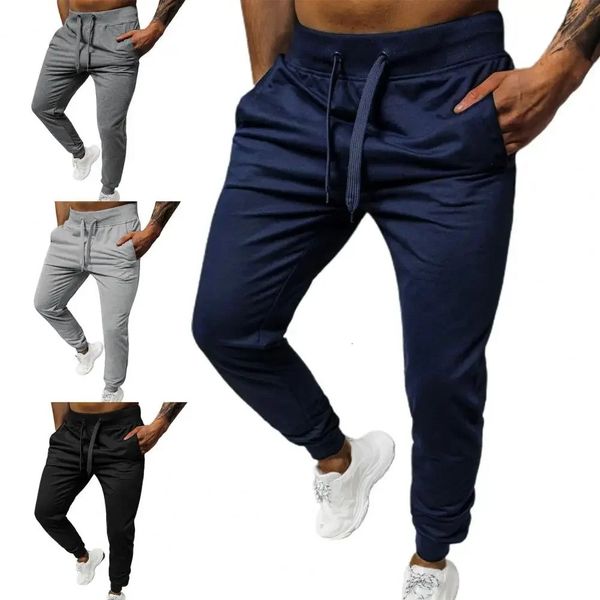 Pantaloni da uomo a fascia con caviglia a colori solidi semplici pantaloni elastici tasche elastiche tasche di sovradimension di oversize streetwear per l'autunno 240423