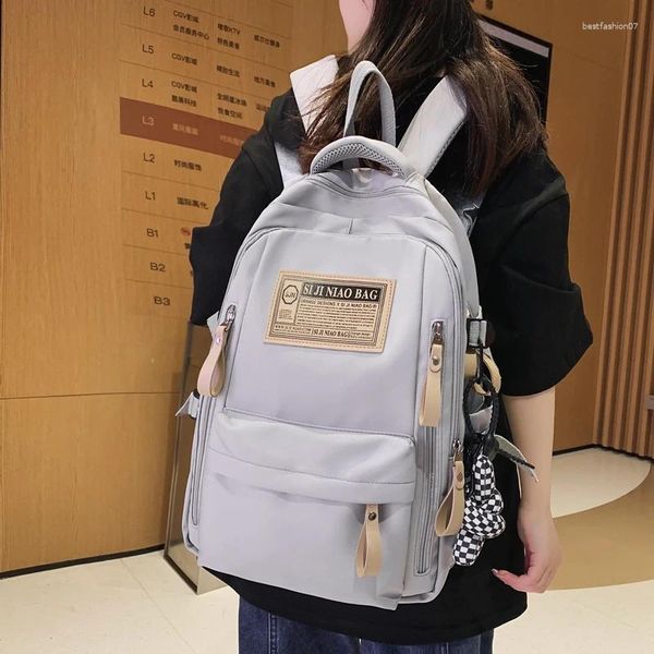 Backpack Fashion Letter Women Boy Cool Teenager School Bag Nylon Livro de viagens femininas Faculdade estudantil de alta capacidade