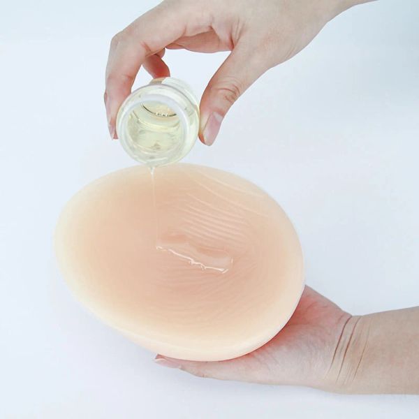 Энхансер грудь образует клей и брюшной брелок с удалением силиконового клея клей.